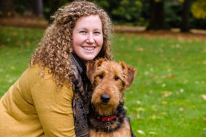 Young,Woman,With,Dog,In,A,Park